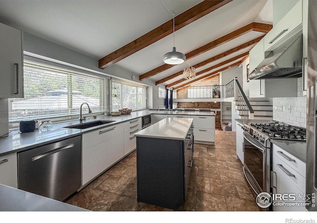 5004 Fox Hill Dr, Longmont, CO 80504 - kitchen with stainless steel appliances, backsplash, white cabinetry, and a center island