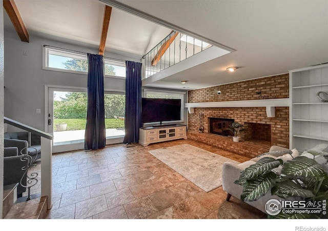 5004 Fox Hill Dr, Longmont, CO 80504 - living area with stone tile floors, a brick fireplace, beamed ceiling, built in shelves, and stairway