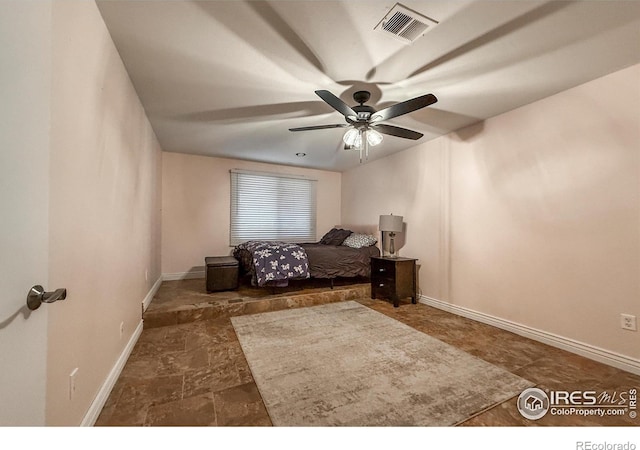 5004 Fox Hill Dr, Longmont, CO 80504 - bedroom featuring stone finish floors and ceiling fan