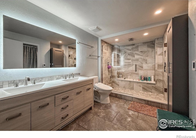 5004 Fox Hill Dr, Longmont, CO 80504 - full bathroom with double vanity, a stall shower, and recessed lighting