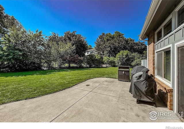 5004 Fox Hill Dr, Longmont, CO 80504 - view of patio / terrace featuring area for grilling and view of scattered trees