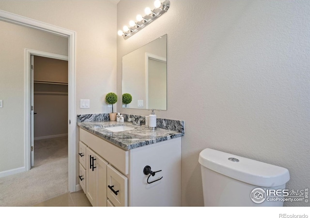 875 E 78th Ave Unit 53, Denver, CO 80229 - bathroom with vanity and toilet