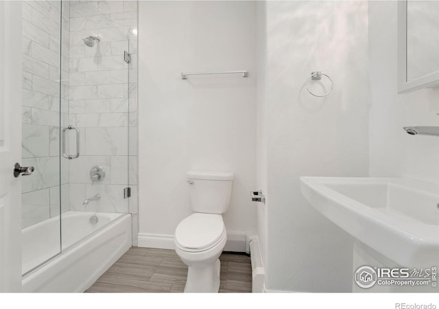 2111 E Alameda Ave, Denver, CO 80209 - bathroom with toilet and shower / bath combination with glass door