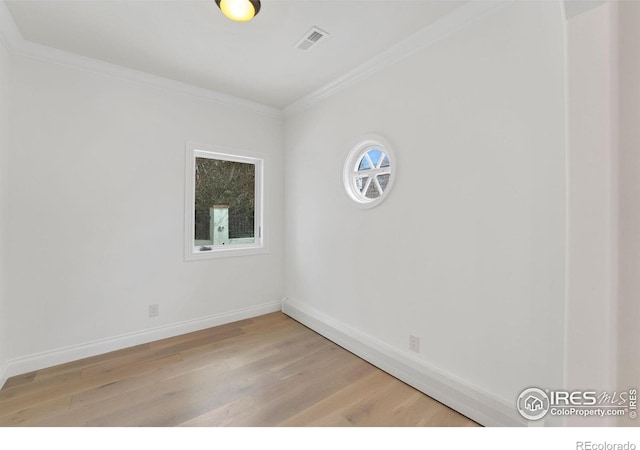 2111 E Alameda Ave, Denver, CO 80209 - unfurnished room with light wood-type flooring and ornamental molding