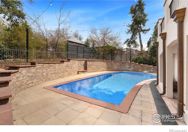 2111 E Alameda Ave, Denver, CO 80209 - view of pool featuring a patio area and a fenced backyard