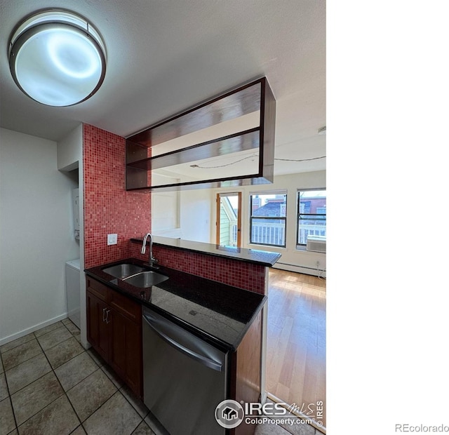 3025 Broadway St Unit 17, Boulder, CO 80304 - kitchen with stainless steel dishwasher, estacked washer and dryer, and backsplash