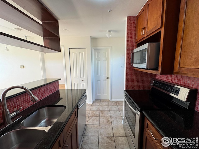 3025 Broadway St Unit 17, Boulder, CO 80304 - kitchen featuring stainless steel appliances, backsplash, brown cabinets, and open shelves