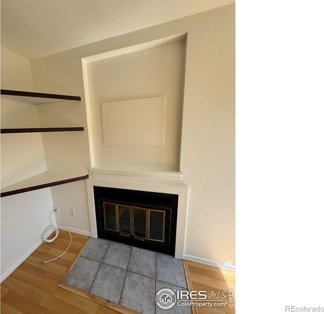 3025 Broadway St Unit 17, Boulder, CO 80304 - detailed view of a fireplace with flush hearth and wood finished floors