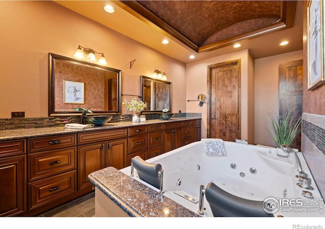 1740 N Ridge Ln, Estes Park, CO 80517 - full bathroom featuring double vanity, recessed lighting, vaulted ceiling, and a whirlpool tub