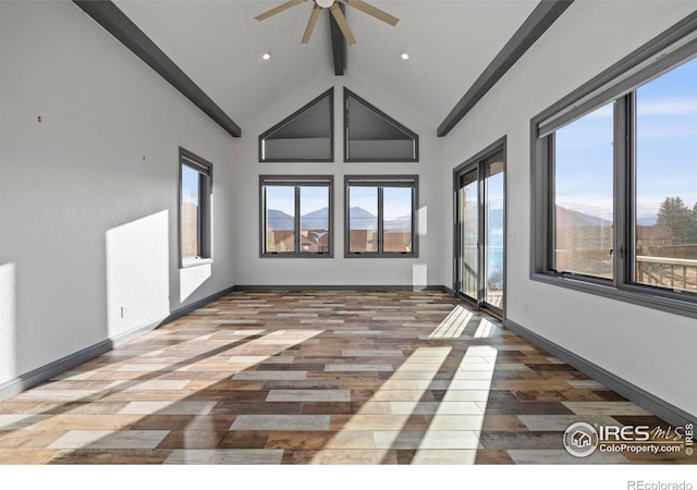 1740 N Ridge Ln, Estes Park, CO 80517 - spare room featuring a ceiling fan, beam ceiling, wood finished floors, high vaulted ceiling, and recessed lighting