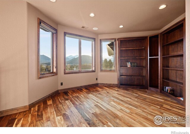 1740 N Ridge Ln, Estes Park, CO 80517 - unfurnished living room with recessed lighting, wood finished floors, and a mountain view