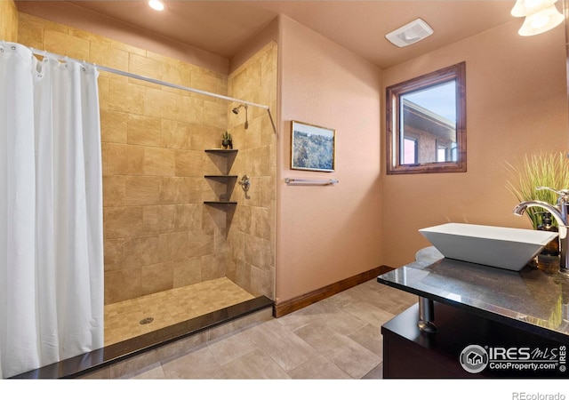 1740 N Ridge Ln, Estes Park, CO 80517 - full bathroom featuring tiled shower, vanity, and recessed lighting