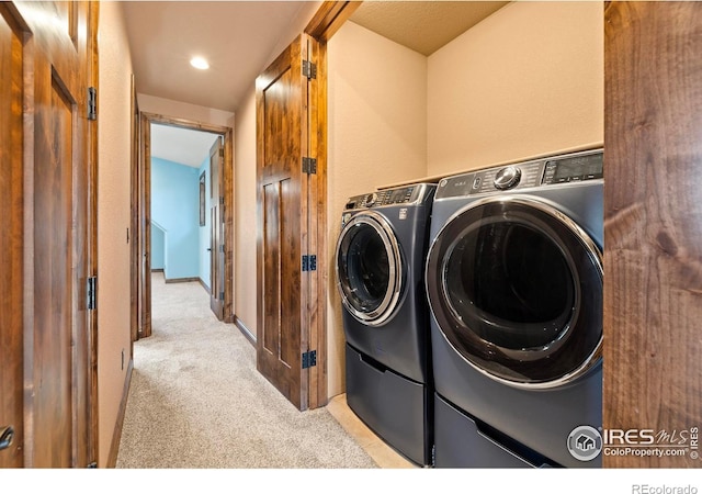 1740 N Ridge Ln, Estes Park, CO 80517 - laundry area with light colored carpet and washing machine and dryer