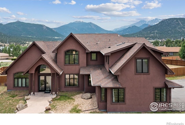 1740 N Ridge Ln, Estes Park, CO 80517 - view of front of property featuring a mountain view, a shingled roof, and stucco siding