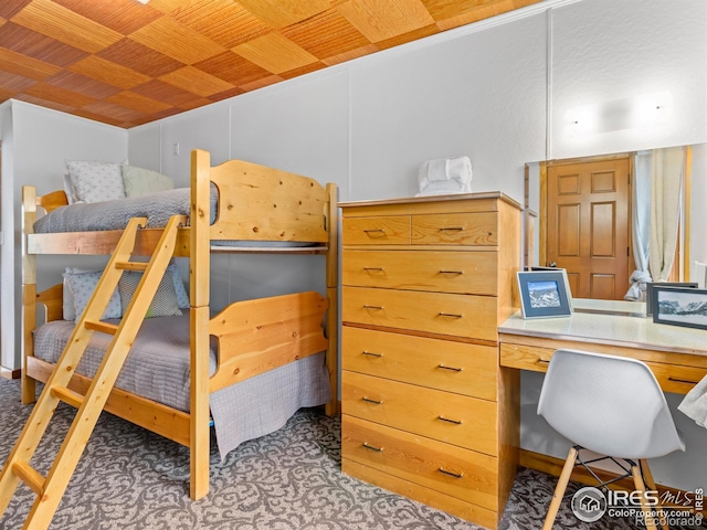 1650 Powelly Ln, Estes Park, CO 80517 - bedroom with carpet, wooden ceiling, and built in desk