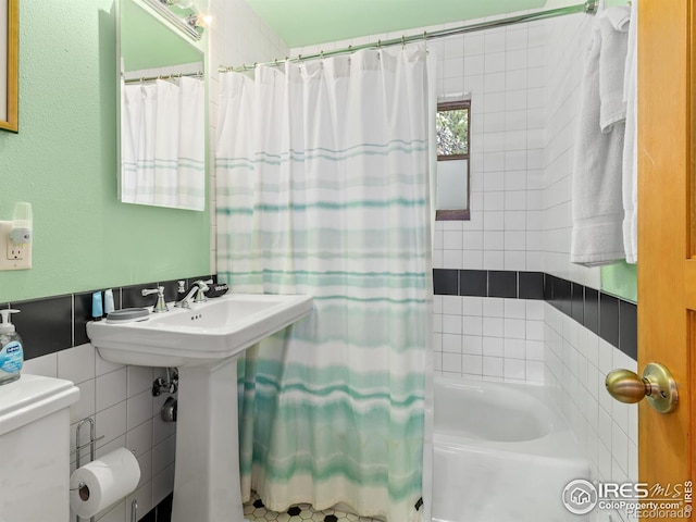 1650 Powelly Ln, Estes Park, CO 80517 - bathroom featuring tile walls and shower / bath combo