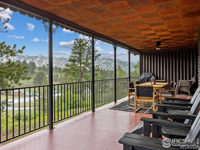 1650 Powelly Ln, Estes Park, CO 80517 - sunroom / solarium featuring a mountain view, outdoor dining space, and ceiling fan
