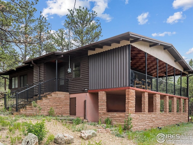 1650 Powelly Ln, Estes Park, CO 80517 - view of property exterior with faux log siding