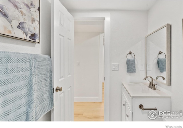 7826 Joan Dr, Denver, CO 80221 - bathroom with vanity and wood finished floors