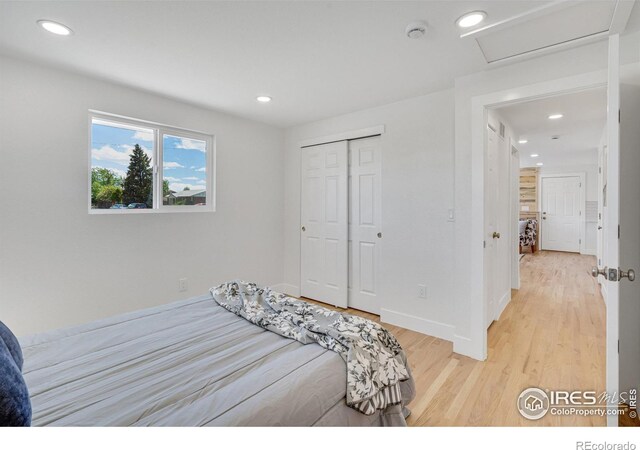 7826 Joan Dr, Denver, CO 80221 - bedroom with attic access, light wood-type flooring, recessed lighting, and a closet