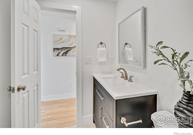 7826 Joan Dr, Denver, CO 80221 - bathroom with vanity and wood finished floors