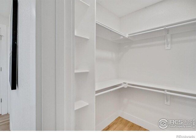7826 Joan Dr, Denver, CO 80221 - walk in closet with light wood finished floors