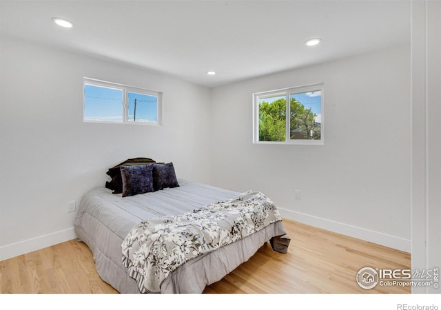 7826 Joan Dr, Denver, CO 80221 - bedroom with recessed lighting and wood finished floors