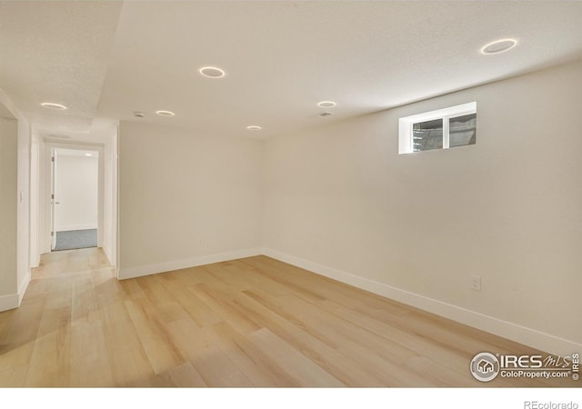7826 Joan Dr, Denver, CO 80221 - unfurnished room with light wood-style floors and a textured ceiling