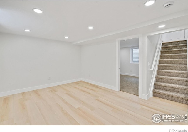 7826 Joan Dr, Denver, CO 80221 - below grade area featuring recessed lighting, stairs, and light wood-style floors