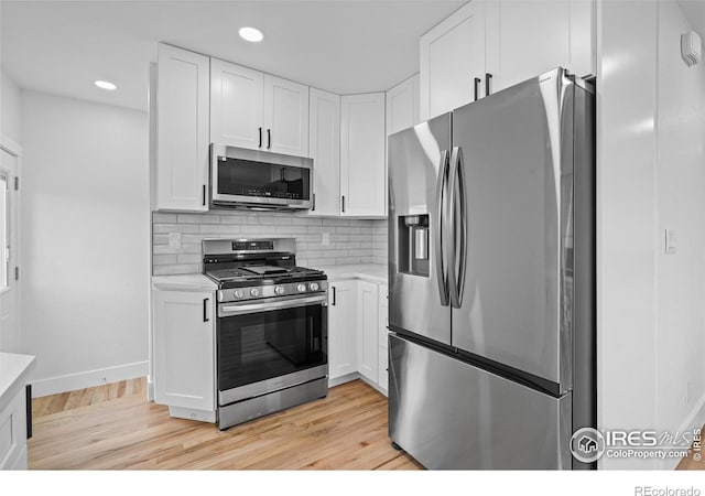 9230 Aspen Dr, Thornton, CO 80229 - kitchen with appliances with stainless steel finishes, light countertops, light wood-style floors, and recessed lighting