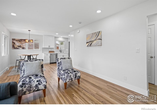 9230 Aspen Dr, Thornton, CO 80229 - living area with light wood-style floors and recessed lighting