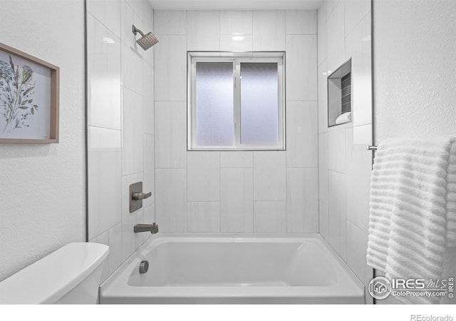 9230 Aspen Dr, Thornton, CO 80229 - bathroom with bathtub / shower combination and a textured wall
