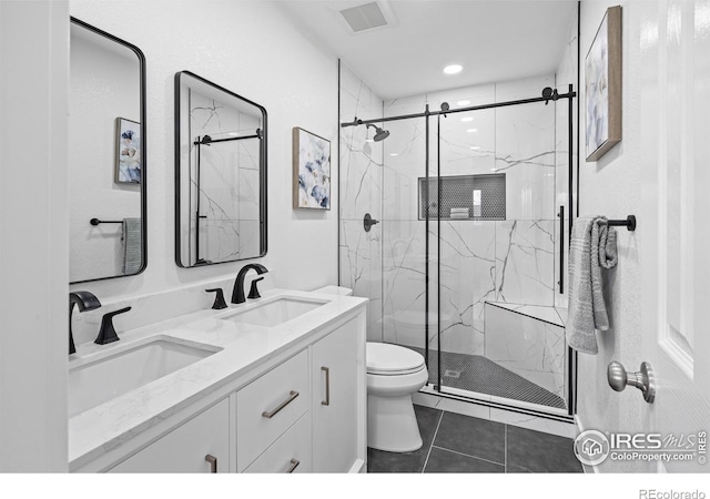 9230 Aspen Dr, Thornton, CO 80229 - bathroom with a marble finish shower, double vanity, tile patterned floors, and recessed lighting