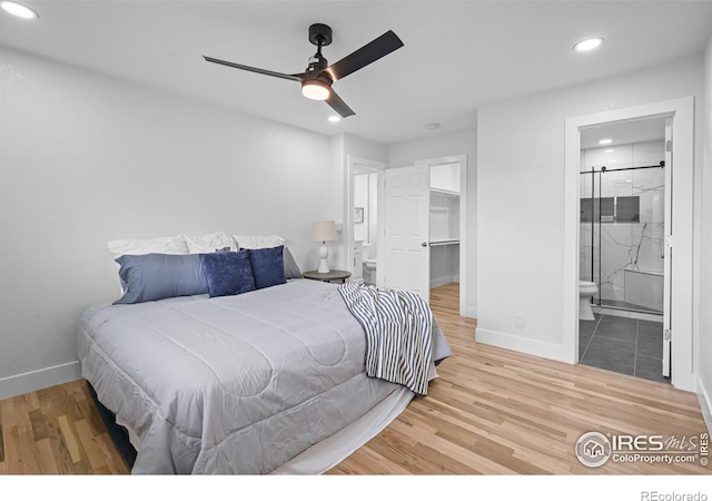 9230 Aspen Dr, Thornton, CO 80229 - bedroom featuring recessed lighting, wood finished floors, a walk in closet, ensuite bath, and a closet