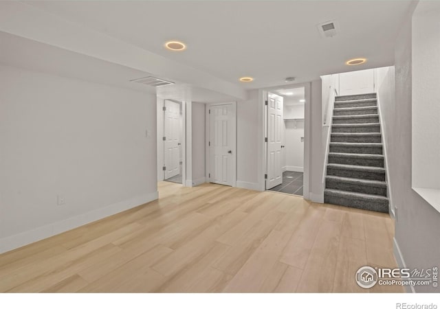 9230 Aspen Dr, Thornton, CO 80229 - unfurnished room with stairs, light wood finished floors, and recessed lighting