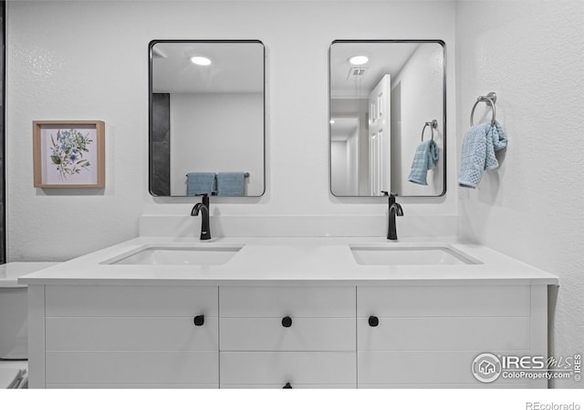 9230 Aspen Dr, Thornton, CO 80229 - bathroom with double vanity and a textured wall