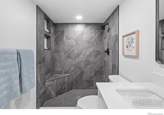 9230 Aspen Dr, Thornton, CO 80229 - bathroom featuring vanity and a tile shower