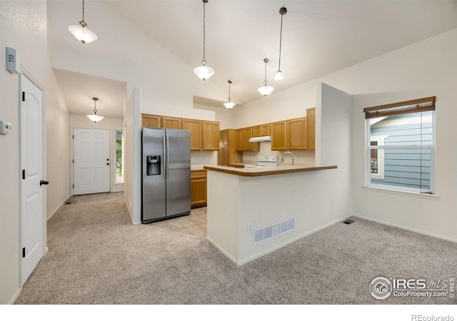 2327 Sunbury Ln, Fort Collins, CO 80524 - kitchen featuring stainless steel fridge, light carpet, white range, under cabinet range hood, and high vaulted ceiling
