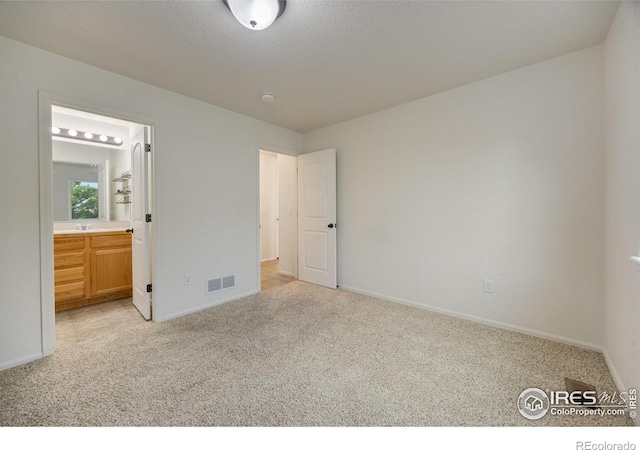 2327 Sunbury Ln, Fort Collins, CO 80524 - unfurnished bedroom with light carpet and connected bathroom