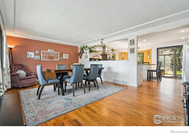 7423 Saulsbury St, Arvada, CO 80003 - dining area with wood finished floors and recessed lighting