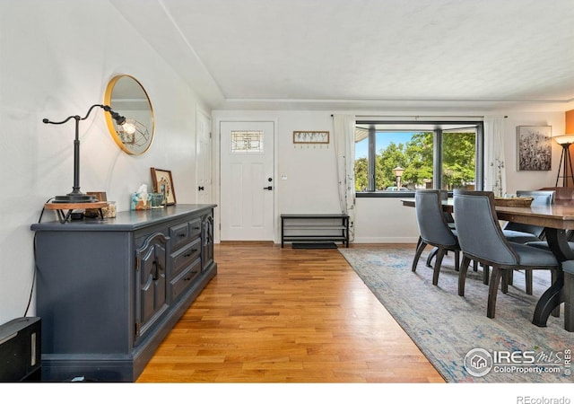 7423 Saulsbury St, Arvada, CO 80003 - dining space featuring light wood finished floors and baseboards