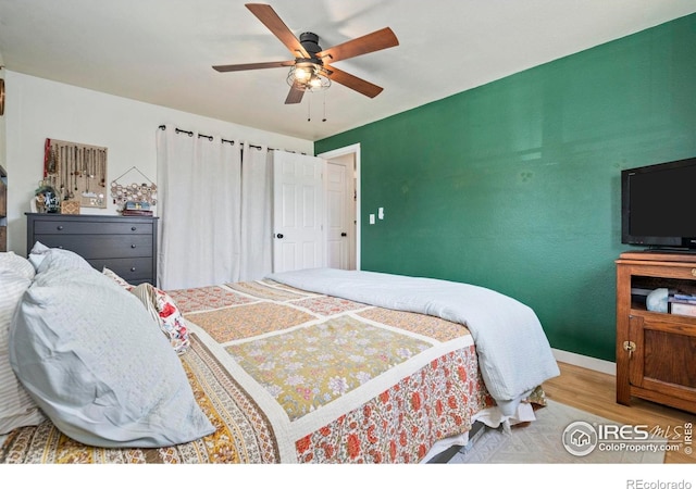 7423 Saulsbury St, Arvada, CO 80003 - bedroom featuring wood finished floors and ceiling fan