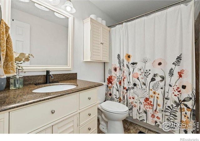 7423 Saulsbury St, Arvada, CO 80003 - bathroom featuring vanity and curtained shower