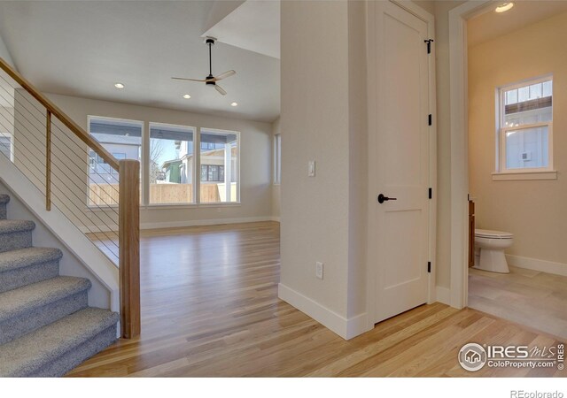 961 Eldorado Ln, Louisville, CO 80027 - hall featuring light wood-style flooring, healthy amount of natural light, stairs, and recessed lighting