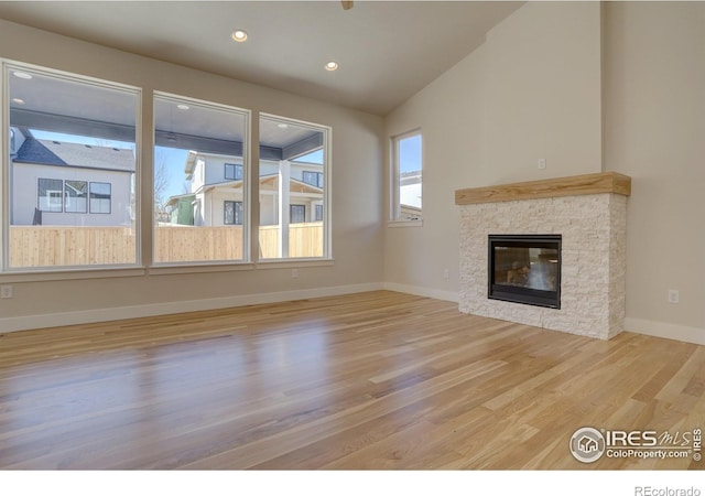 961 Eldorado Ln, Louisville, CO 80027 - unfurnished living room with wood finished floors, a fireplace, lofted ceiling, and recessed lighting