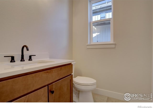 961 Eldorado Ln, Louisville, CO 80027 - half bathroom featuring vanity and tile patterned floors