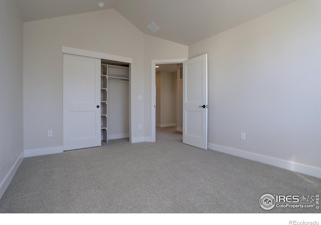 961 Eldorado Ln, Louisville, CO 80027 - unfurnished bedroom featuring light colored carpet, vaulted ceiling, and a closet