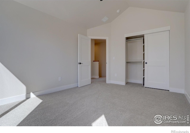 961 Eldorado Ln, Louisville, CO 80027 - unfurnished bedroom with vaulted ceiling, carpet, and a closet