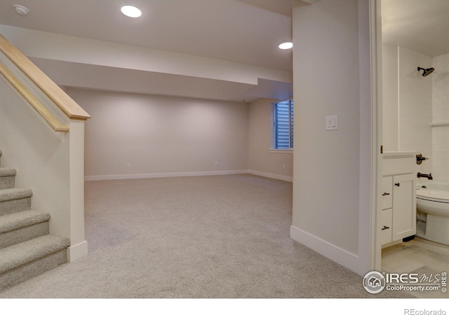 961 Eldorado Ln, Louisville, CO 80027 - below grade area featuring light colored carpet, stairway, and recessed lighting