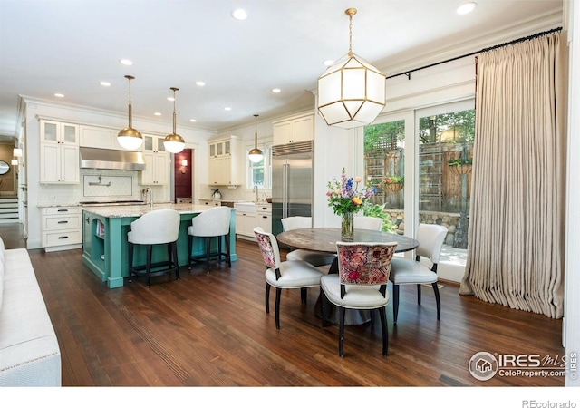 512 Marine St, Boulder, CO 80302 - dining space with dark wood finished floors, ornamental molding, and recessed lighting